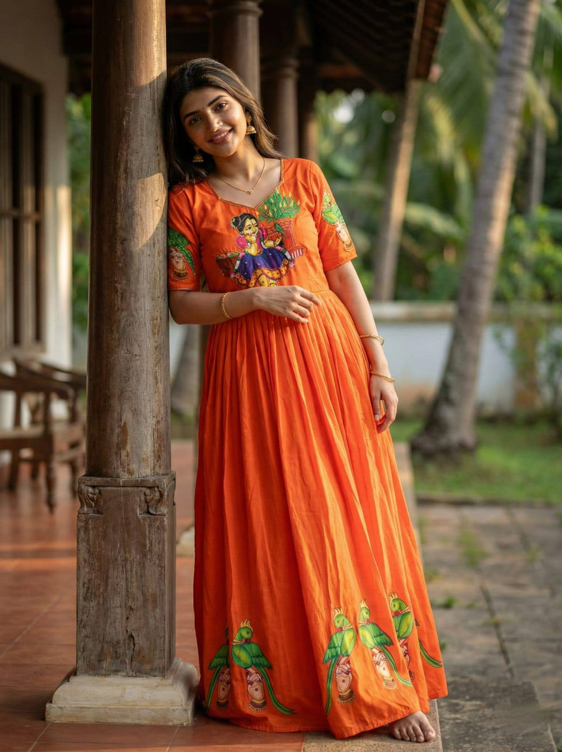 Orange kalamkari printed maslin gown with khatli handwork moti beads