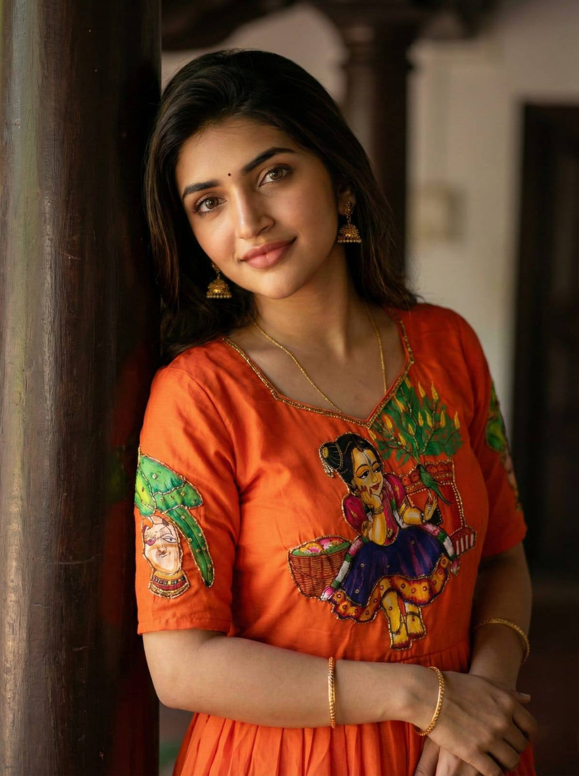 Orange kalamkari printed maslin gown with khatli handwork moti beads