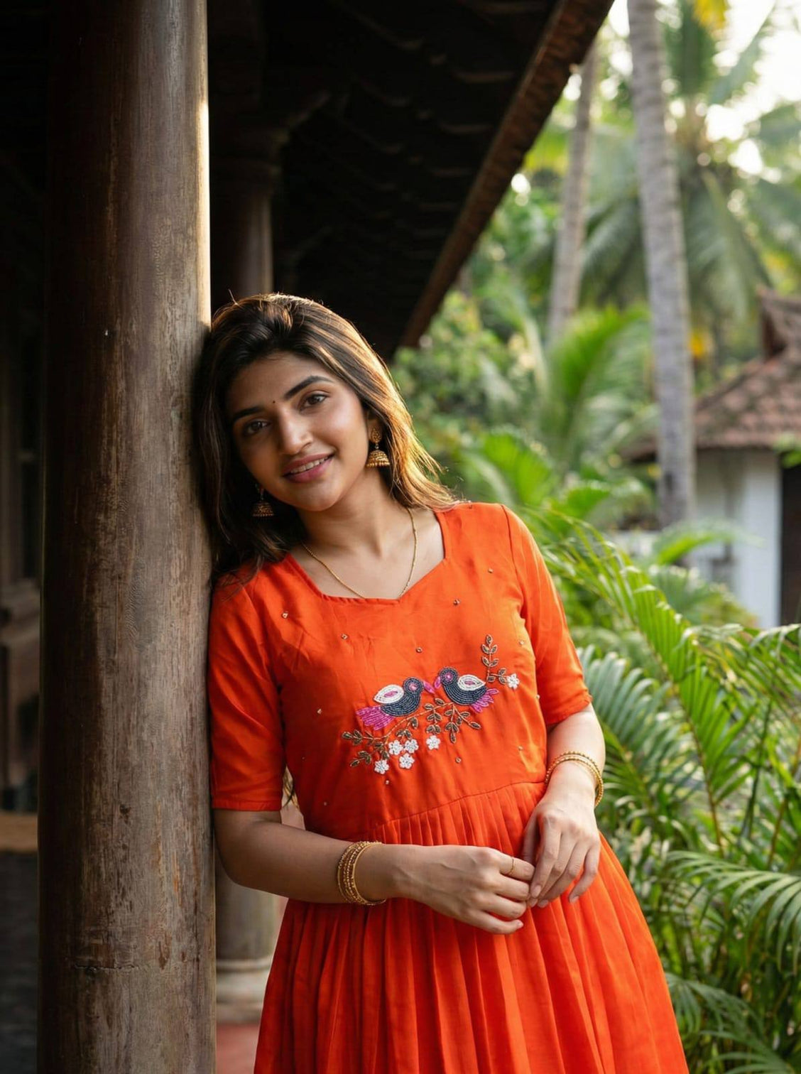 Premium orange ethnic long gown for women