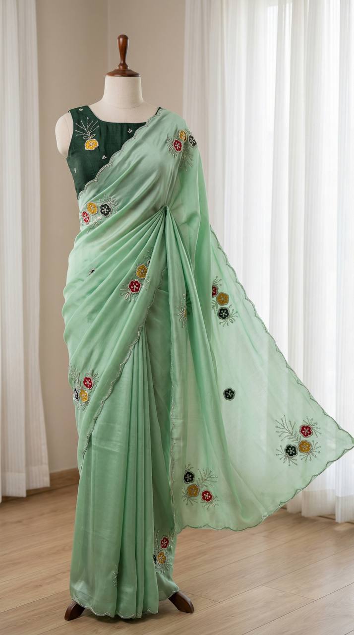 Graceful mint green soft rangoli saree with handwork floral butta