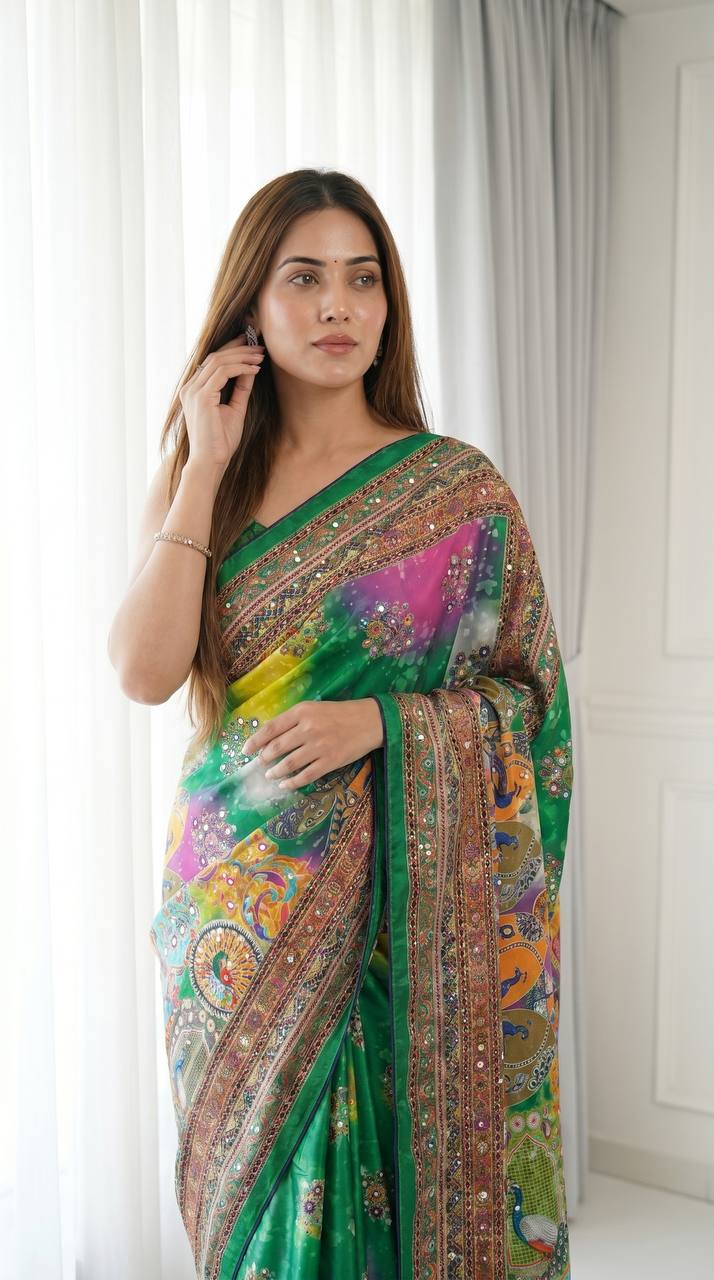 Emerald green artistic digital print modal silk saree with heritage border multicolor motifs decorative tassels