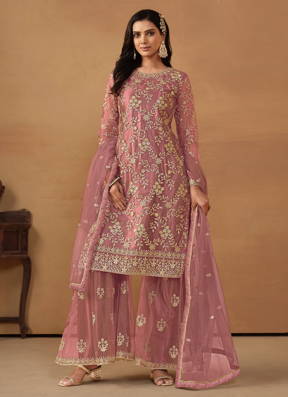 Pink net palazzo salwar suit with sequins embroidery
