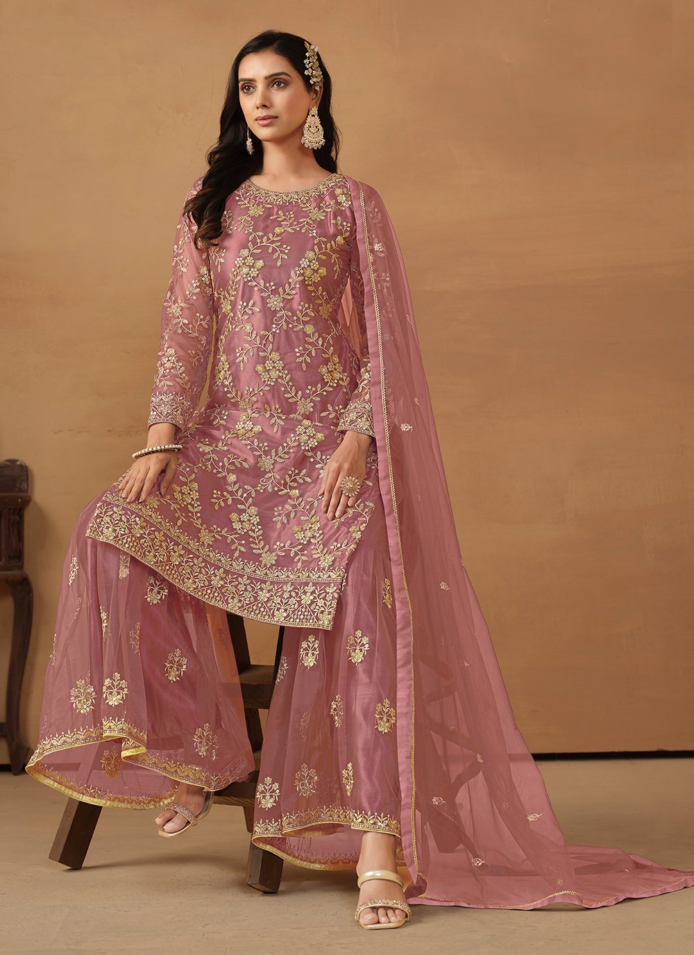 Pink net palazzo salwar suit with sequins embroidery
