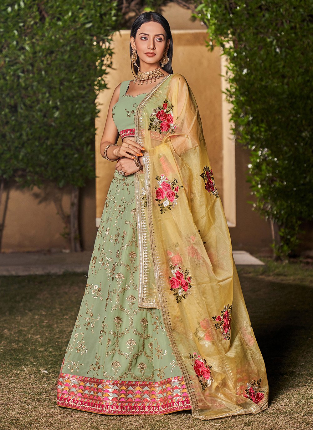 Pista yellow georgette sequins and zari work engagement lehenga