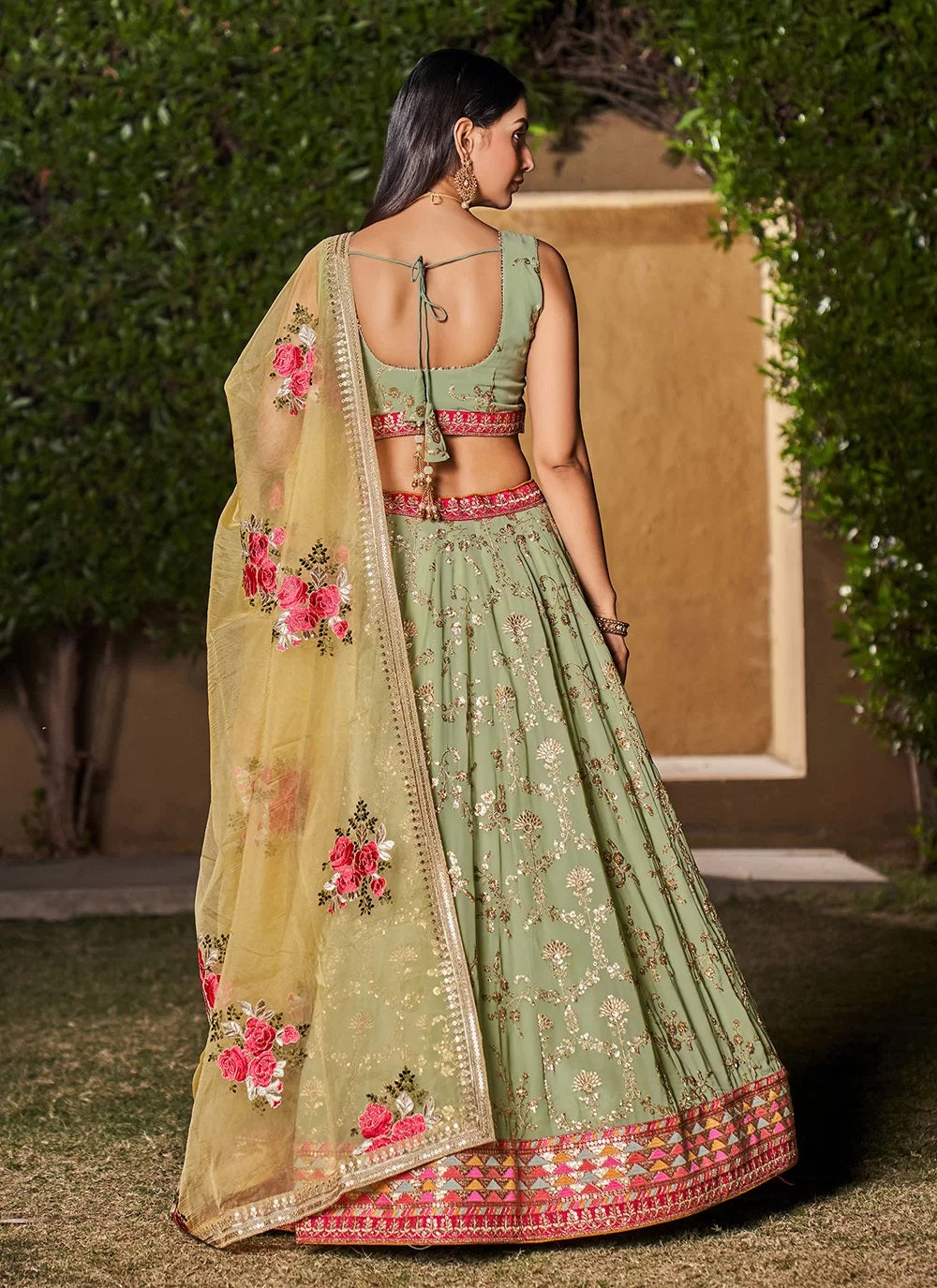 Pista yellow georgette sequins and zari work engagement lehenga