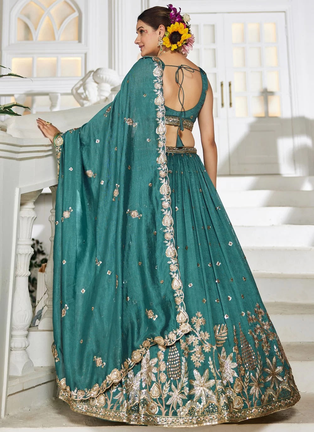 Prestigious teal georgette lehenga with sequins embroidery