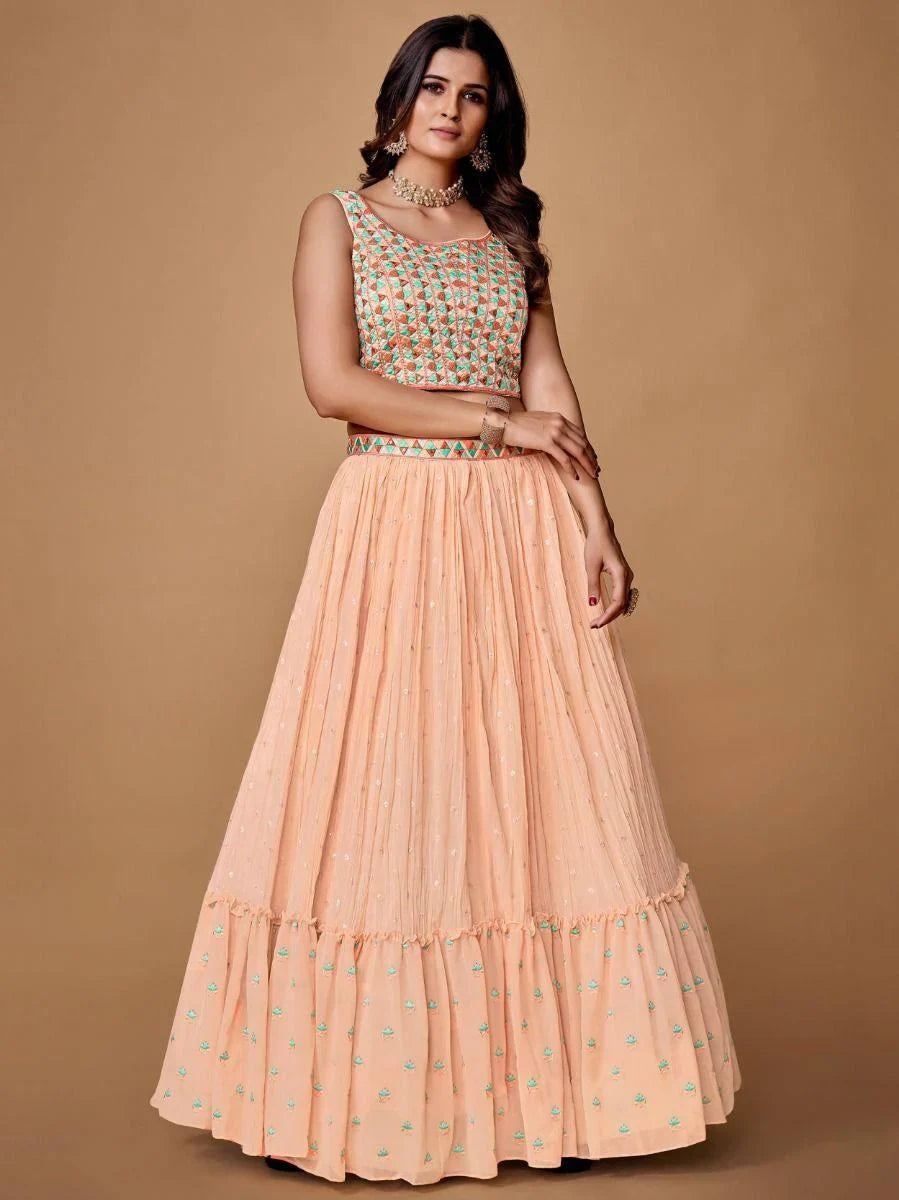 Pretty Peach Embroidered Georgette Reception Wear Lehenga Choli