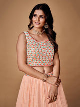 Pretty Peach Embroidered Georgette Reception Wear Lehenga Choli