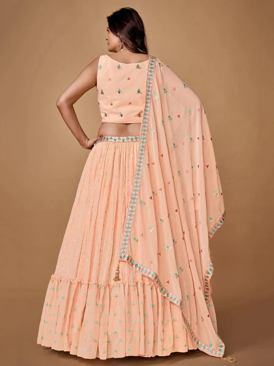 Pretty Peach Embroidered Georgette Reception Wear Lehenga Choli