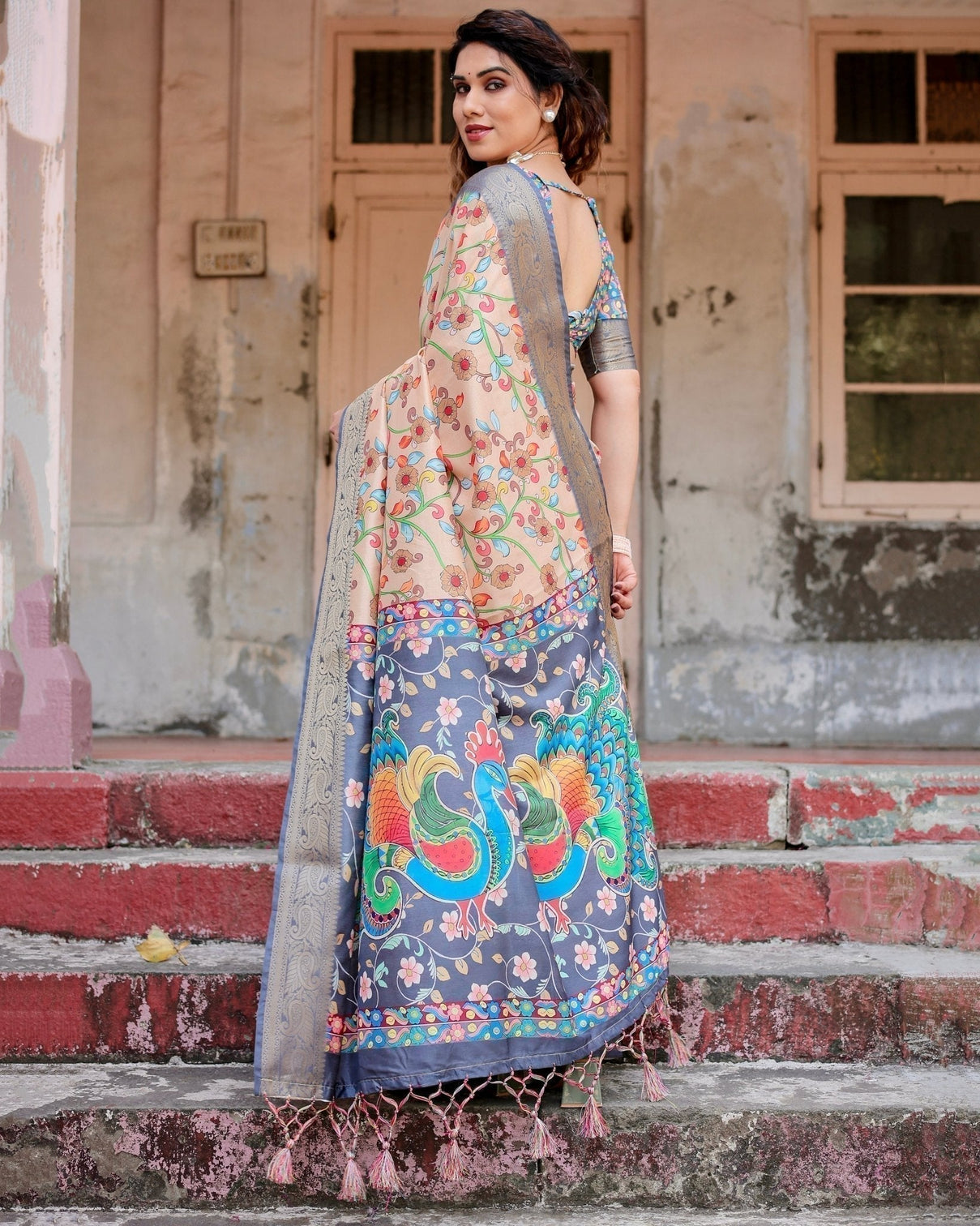 Peach and Navy Blue Floral Saree with Vibrant Peacock Pallu and Tassel Detailing