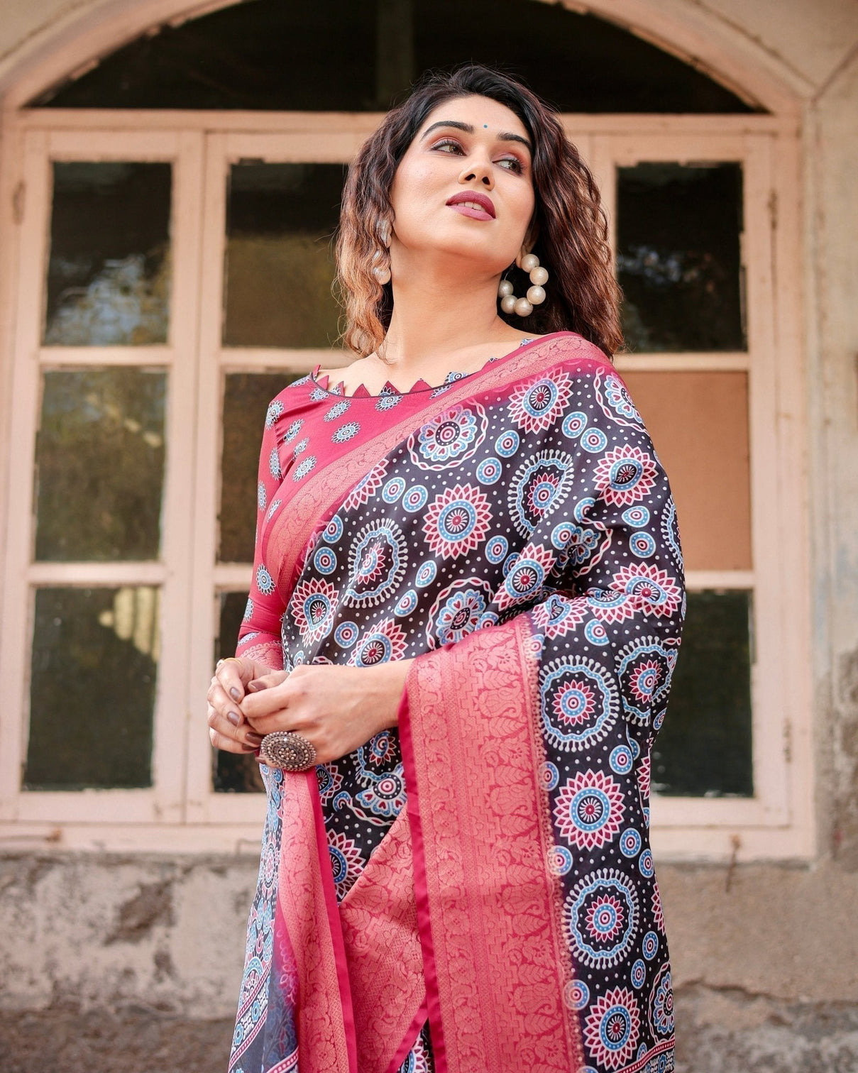 Black and Coral Tussar Silk Saree with Intricate Circular Motifs and Ornamental Pallu