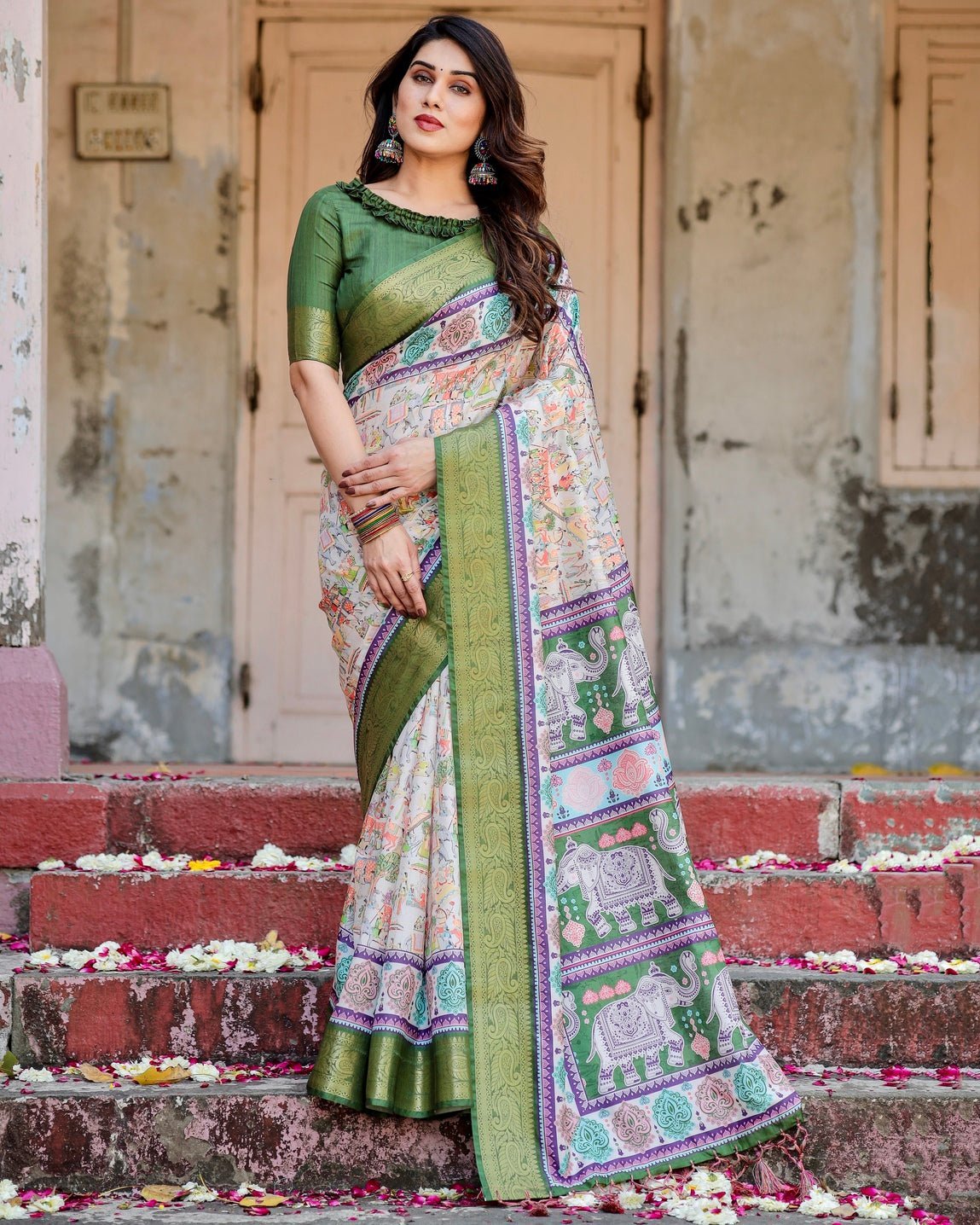 Ivory and Green Tussar Silk Saree with Elephant Motifs and Intricate Zari Border