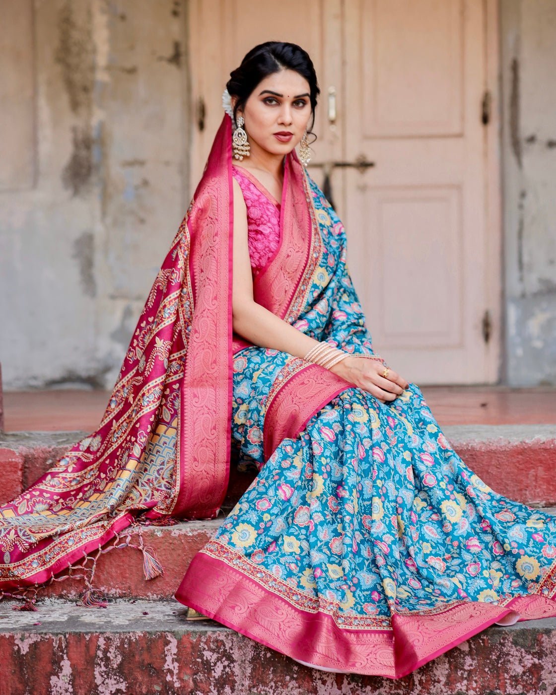 Teal Blue and Coral Tussar Silk Saree with Vibrant Floral Motifs and Ornamental Pallu