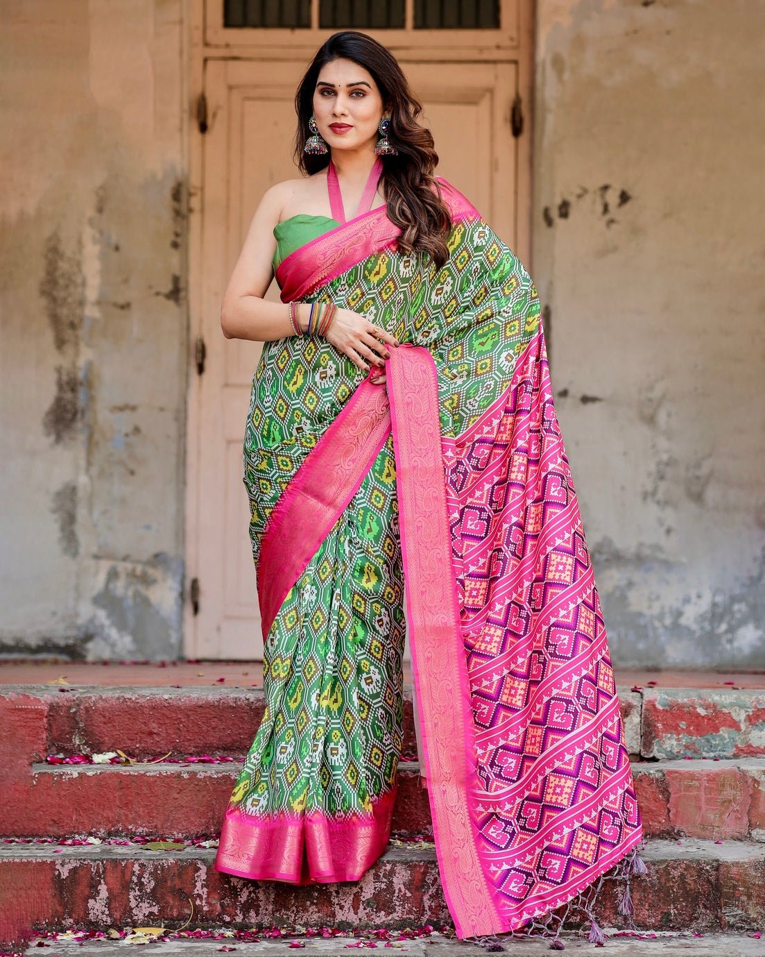 Green and Pink Tussar Silk Saree with Vibrant Ikat Patterns and Zari Border