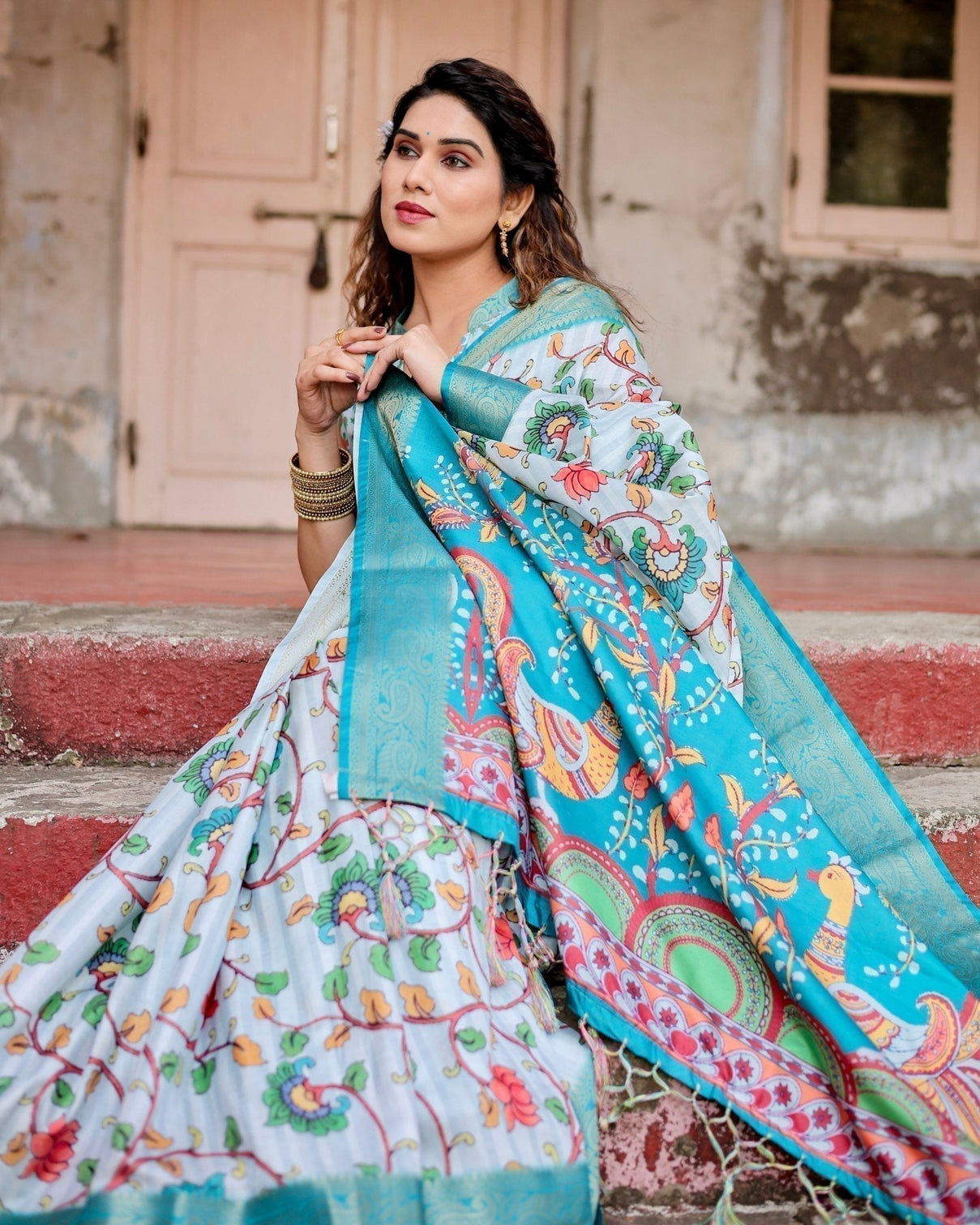 Sky Blue Tussar Silk Saree with Multicolor Floral Design and Zari Paisley Border