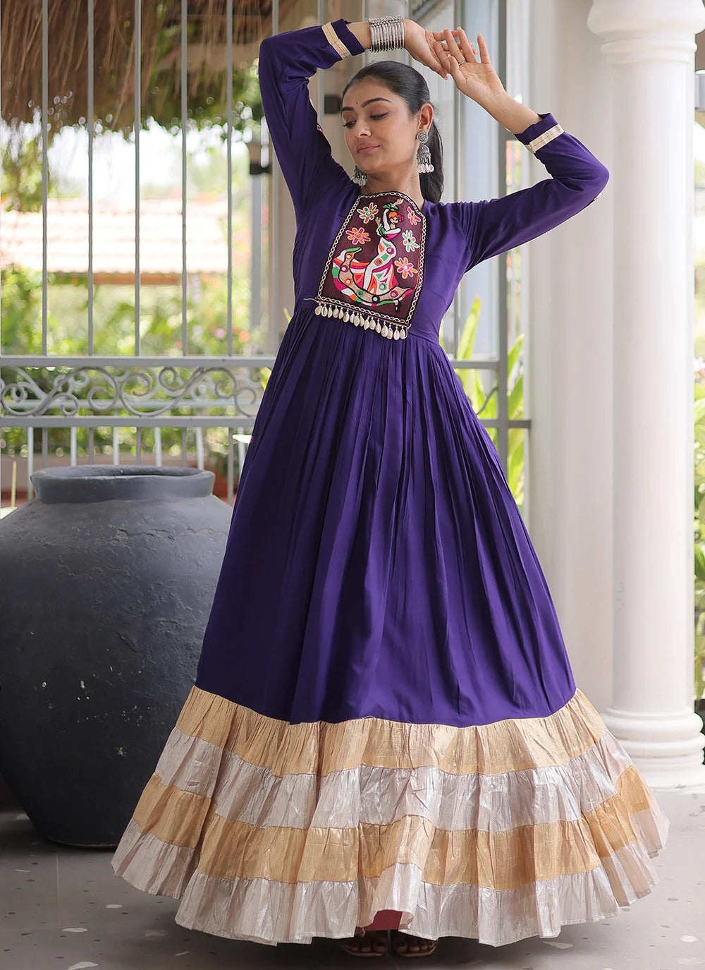 Purple navratri gown with kutchi gamthi work and 12 meter flair