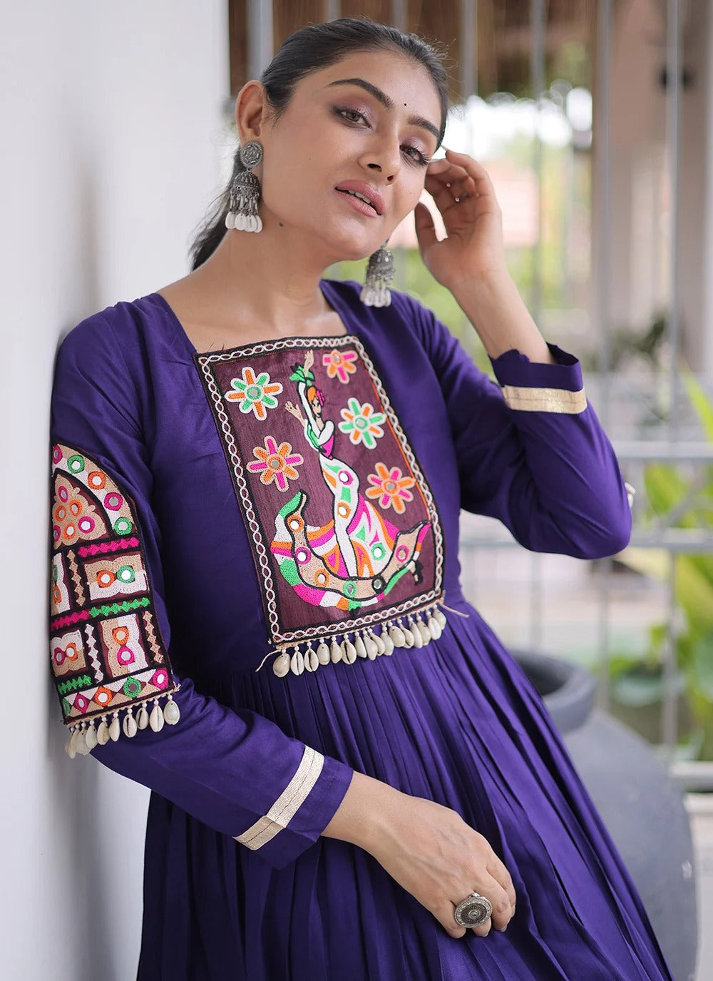 Purple navratri gown with kutchi gamthi work and 12 meter flair