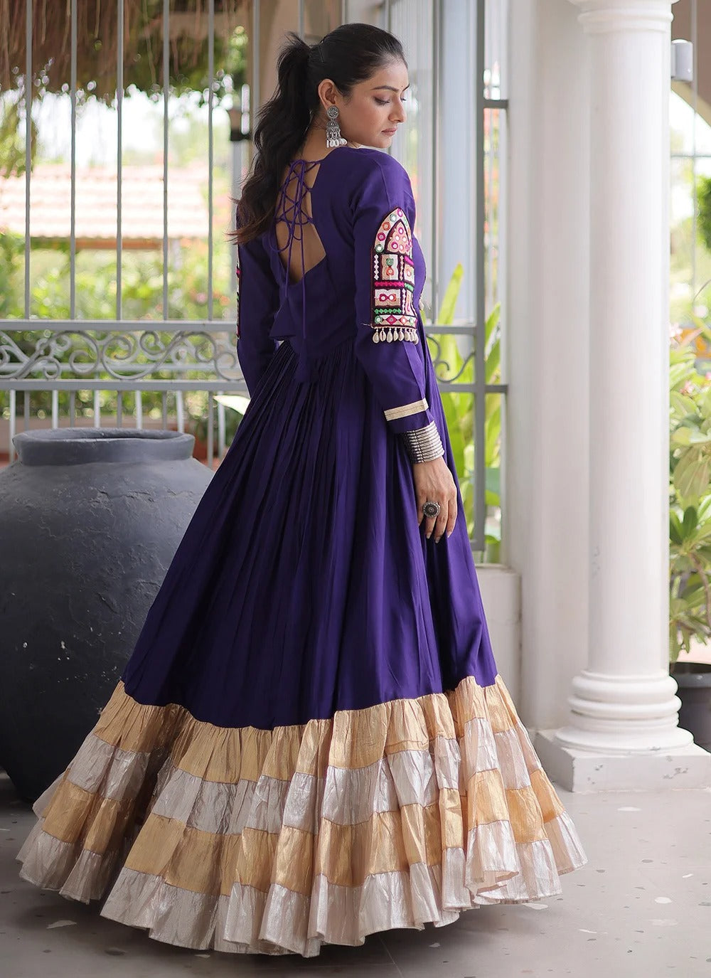 Purple navratri gown with kutchi gamthi work and 12 meter flair