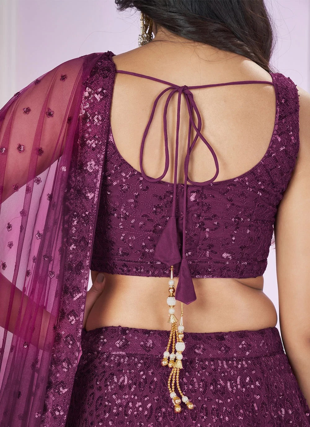 Elegant purple soft net engagement lehenga with sequins embroidery work