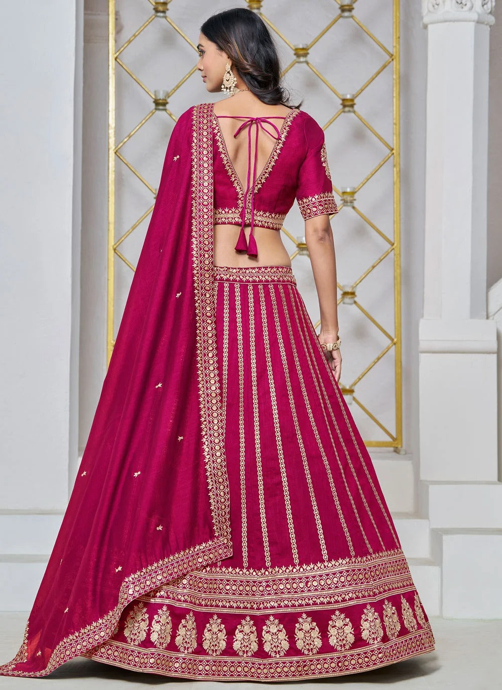 Rani pink lehenga for wedding in art silk with embroidery