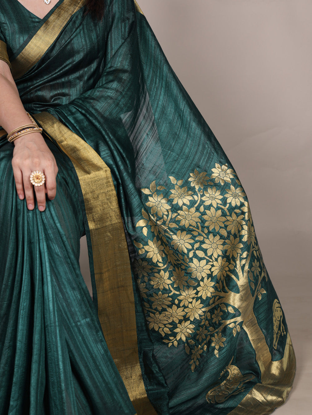 Green raw silk saree with intricate zari weaving unstitched blouse