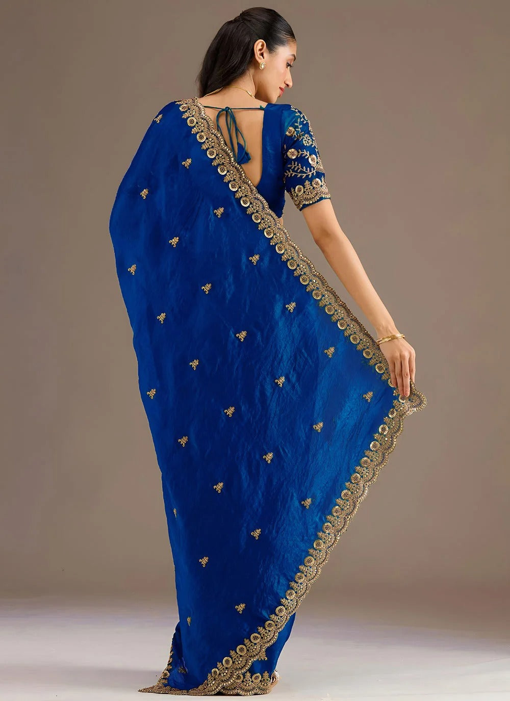 Royal blue reception wear tissue saree with zari embroidery