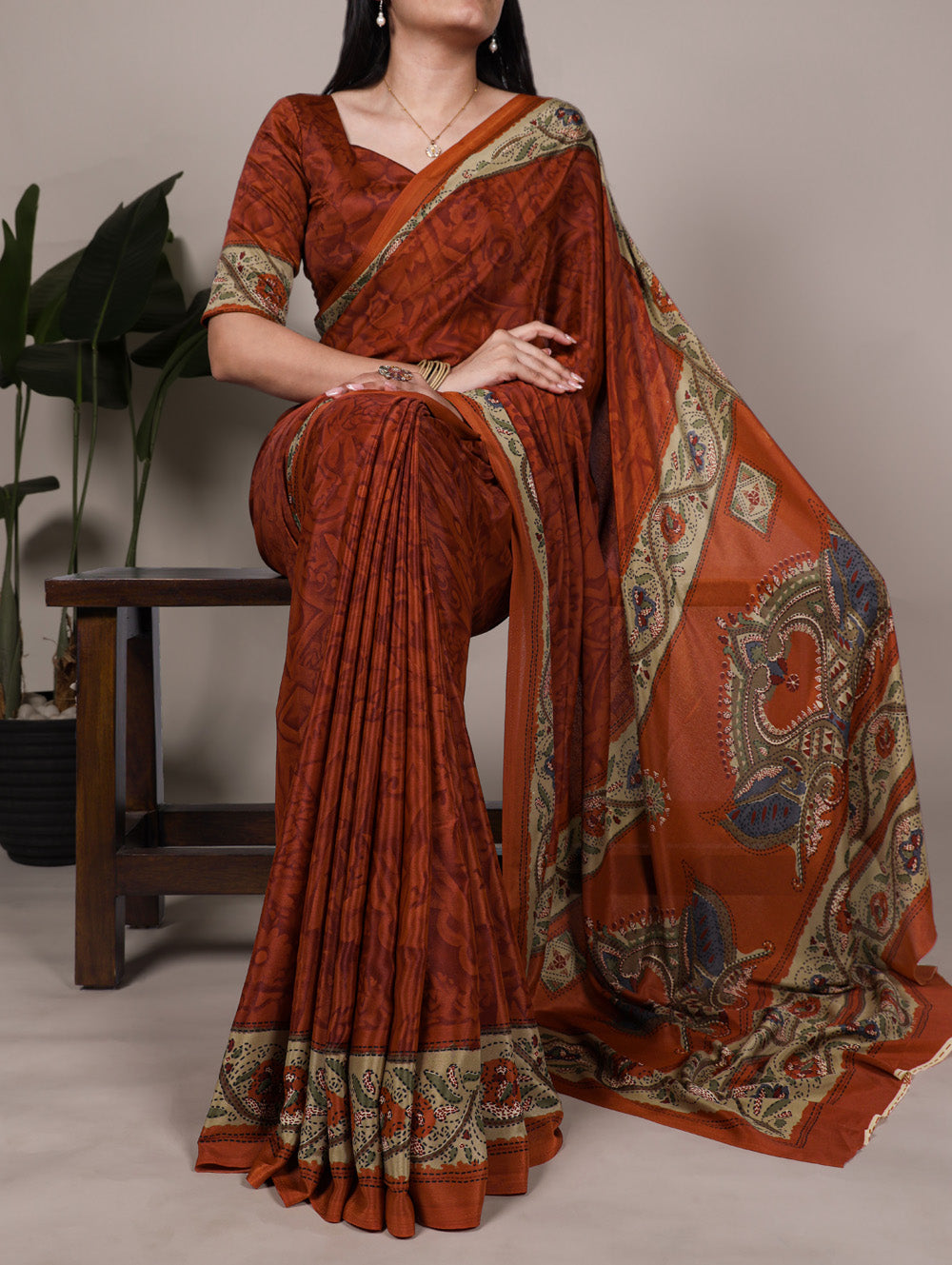 Rust orange crepe saree with all over print matching blouse