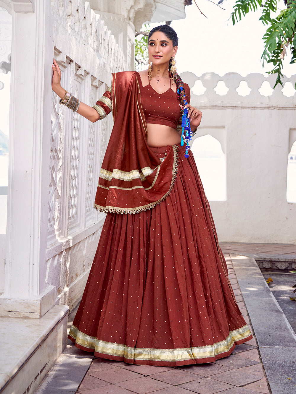 Rust orange chanderi zari weaving lehenga choli with embossed lace dupatta