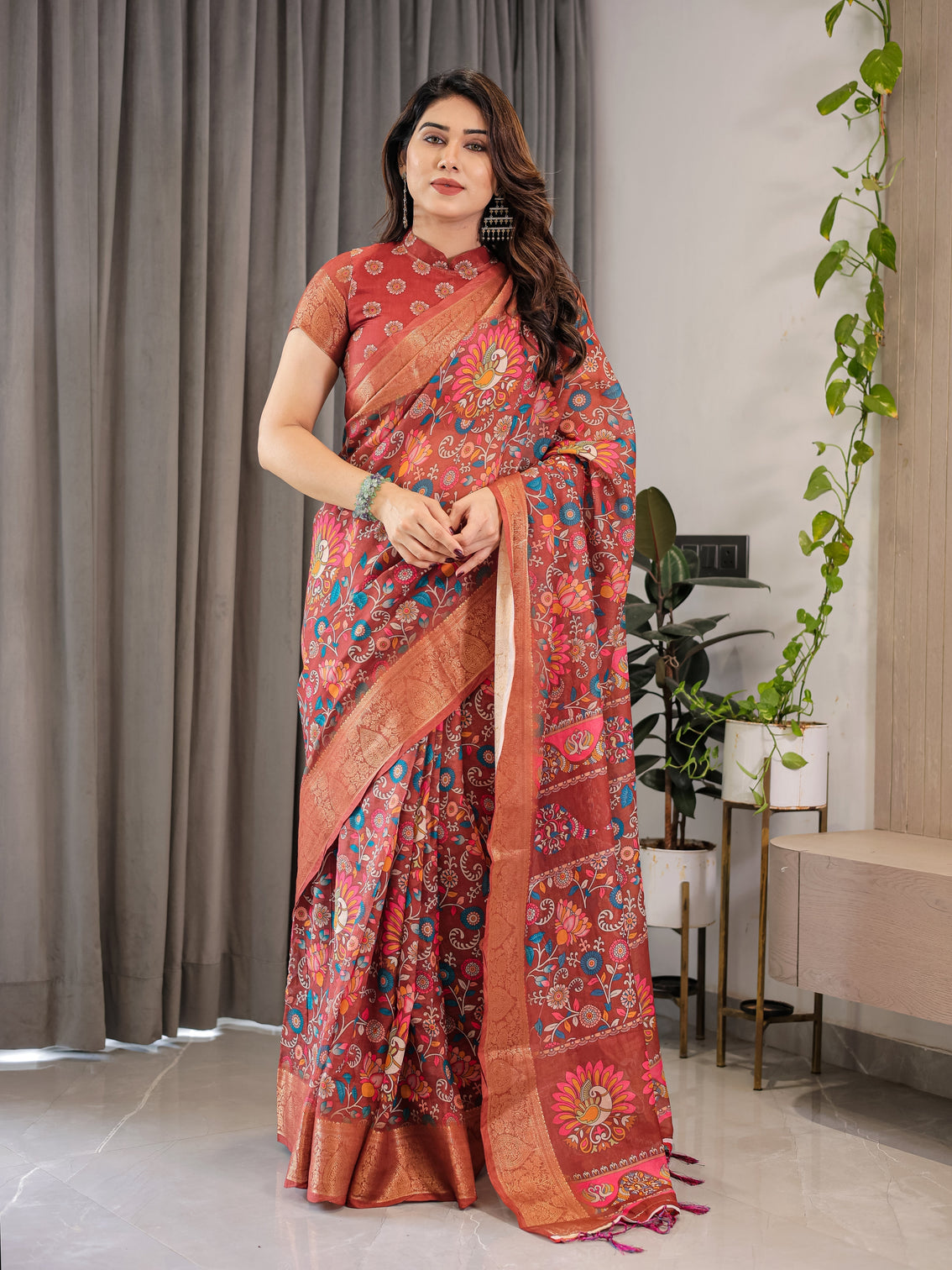 Graceful rust orange floral cotton linen saree with zari border tassels