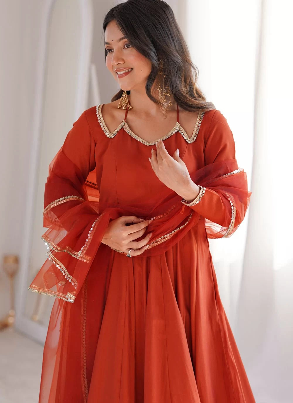 Rust roman silk chanderi anarkali suit with net dupatta for sangeet festive wear
