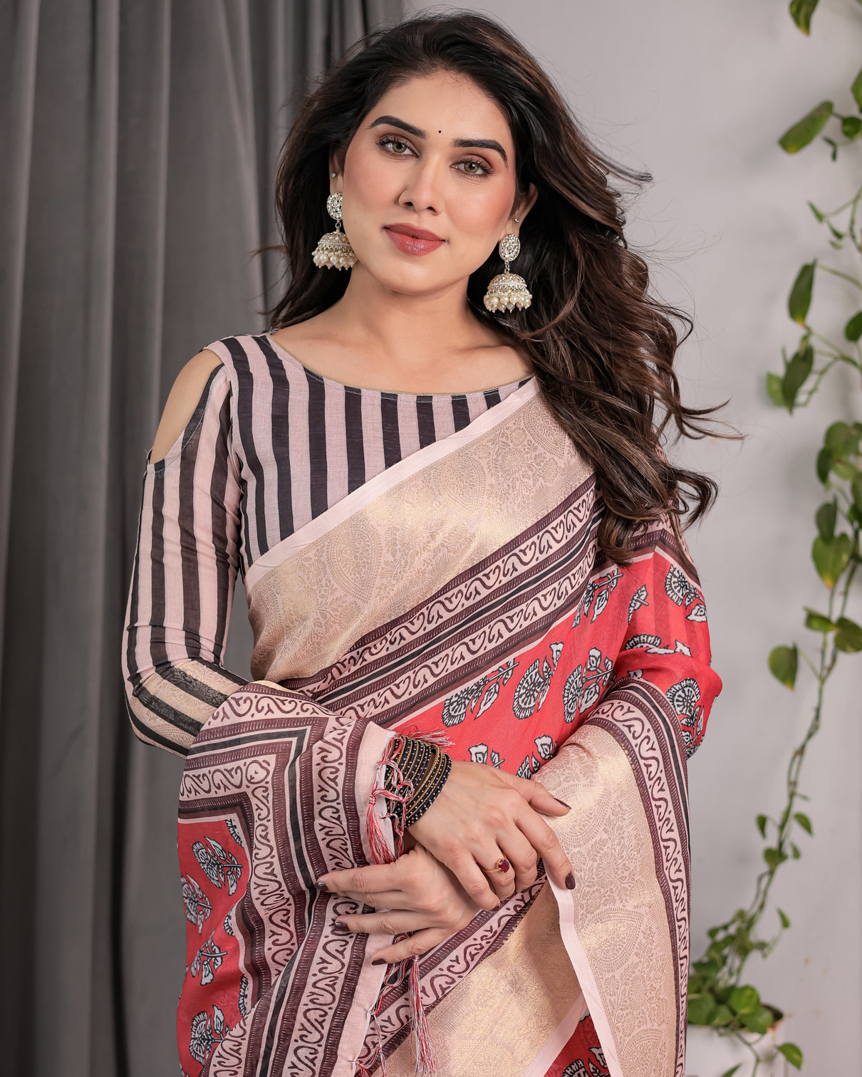 Rust red handloom cotton linen saree with black floral buti print zari border