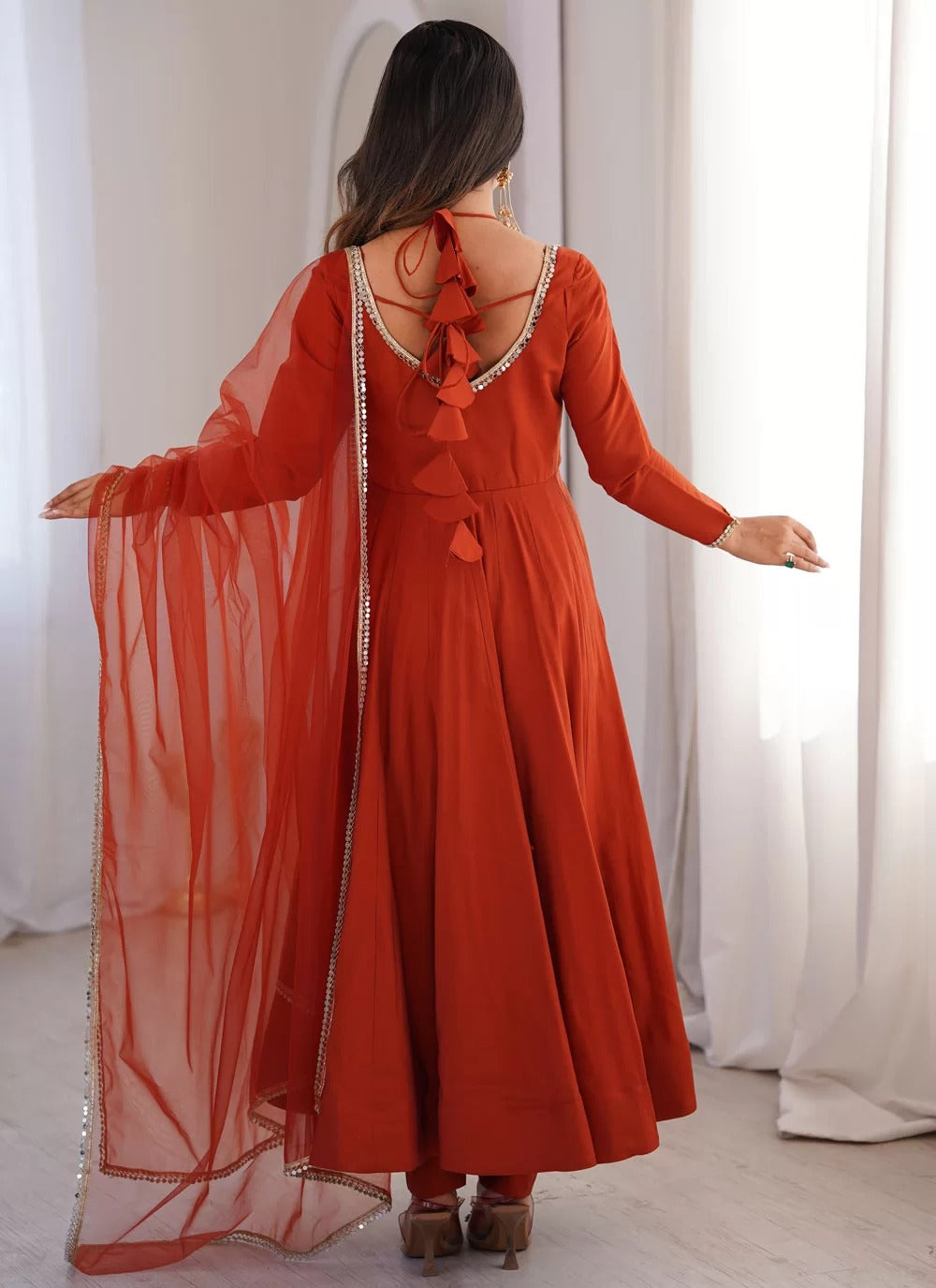 Rust roman silk chanderi anarkali suit with net dupatta for sangeet festive wear