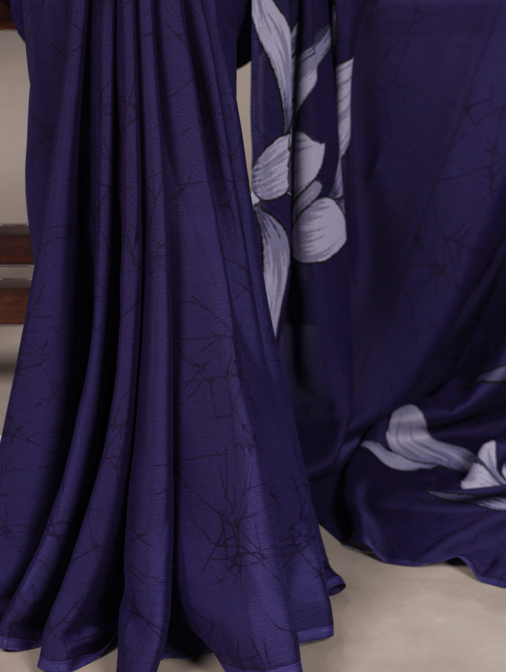 Navy blue satin silk saree with floral print light blue blouse