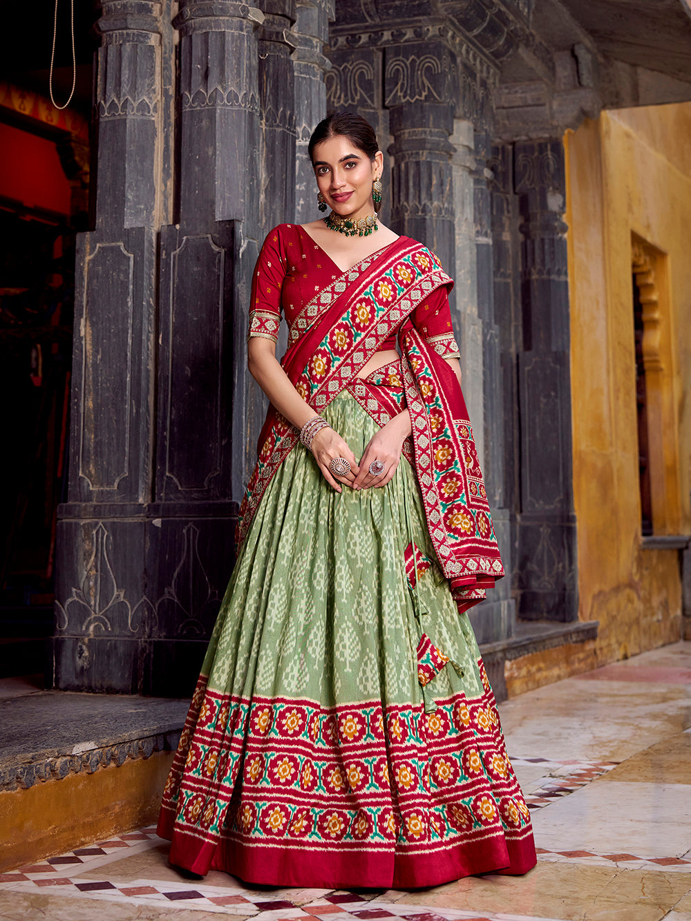Sea green tasar silk ikat patola print lehenga choli set with red embroidered blouse dupatta