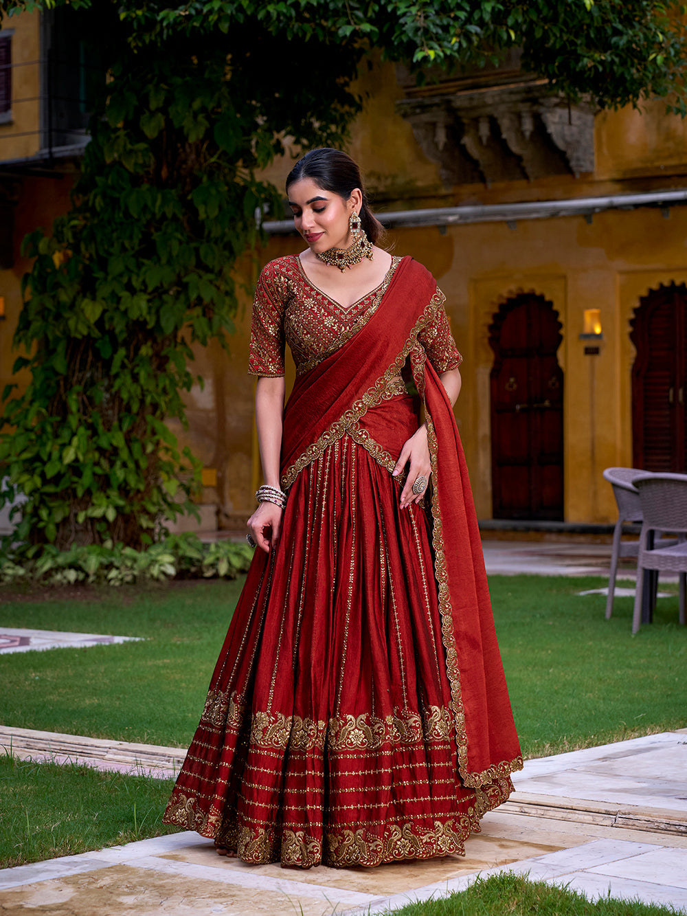 Rust orange rangoli crush party wear lehenga choli with sequins thread embroidery