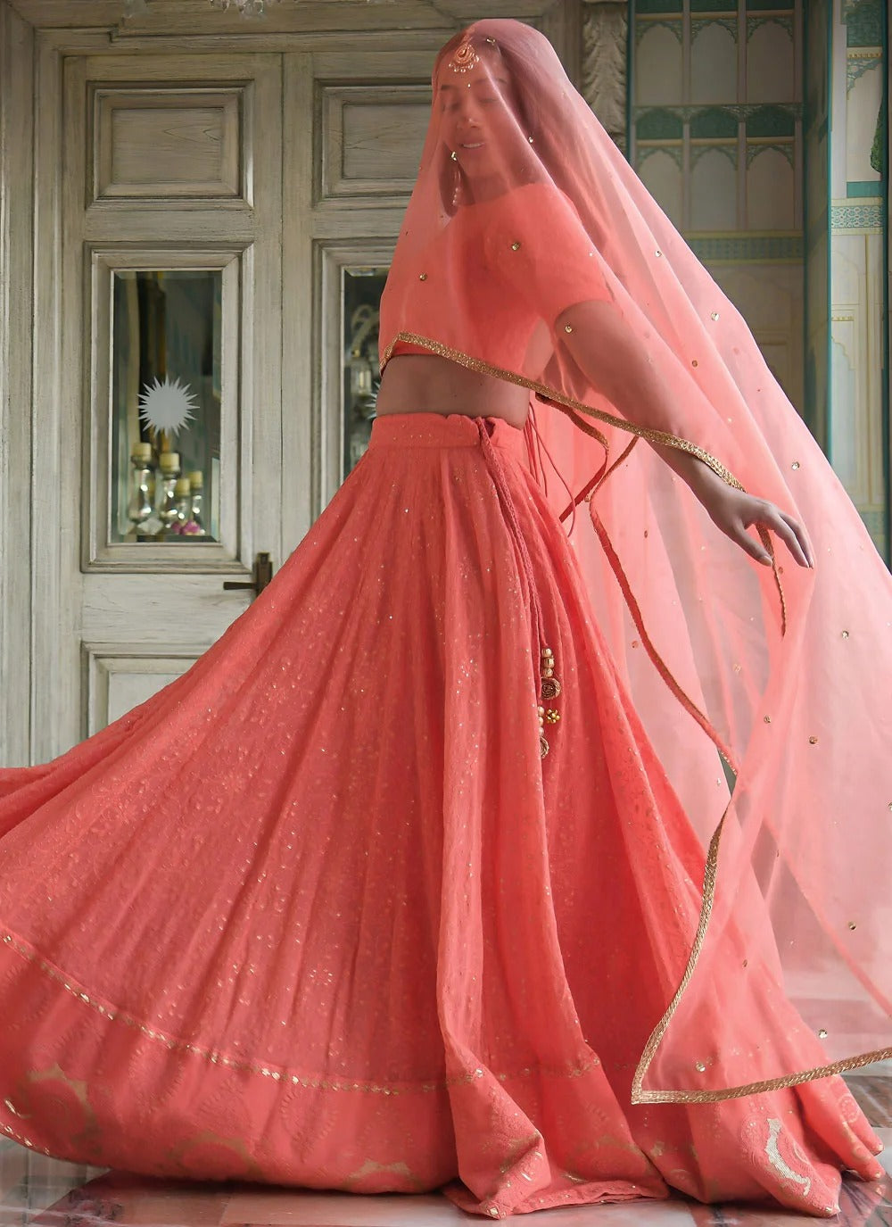 Peach cocktail lehenga in georgette with gota patti embroidery