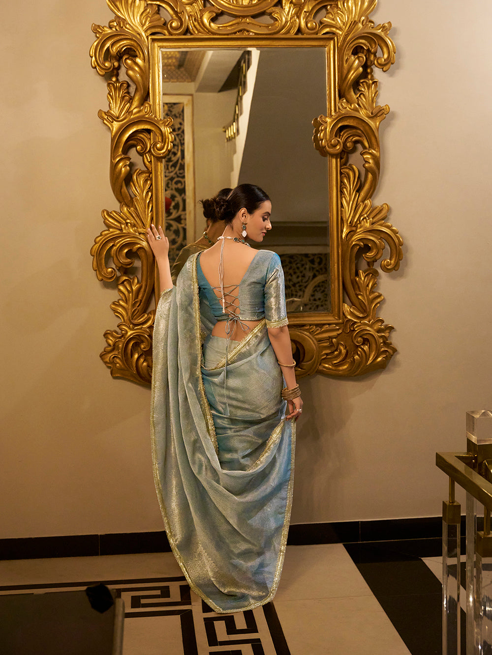 Sky blue zari weaving tissue shimmer saree with sequins lace border and matching blouse
