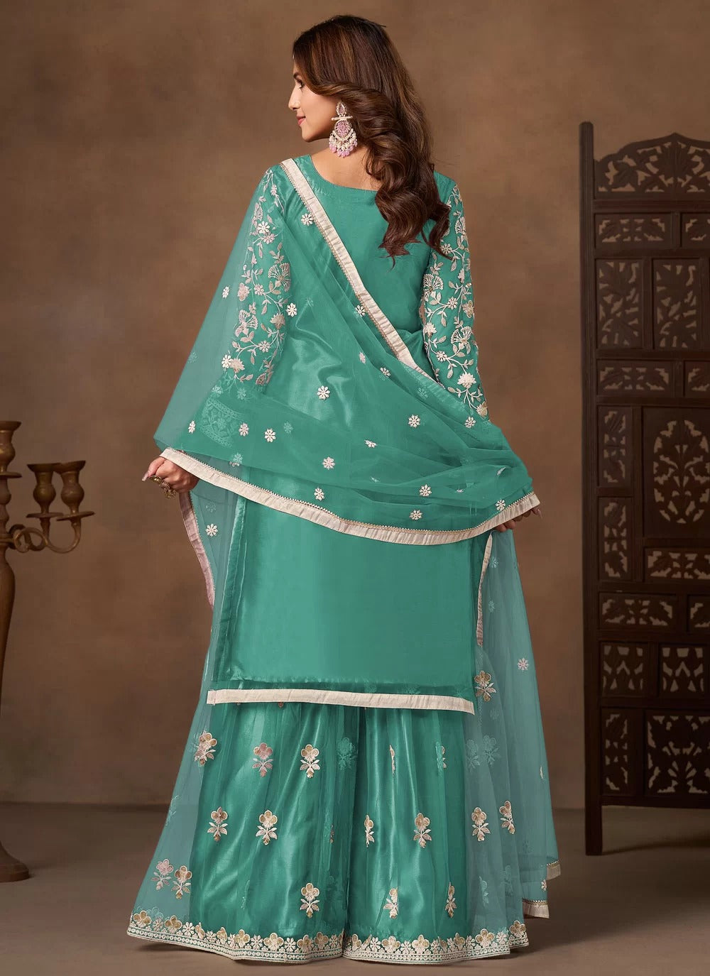 Serene sea green net embroidered palazzo suit for festive wear