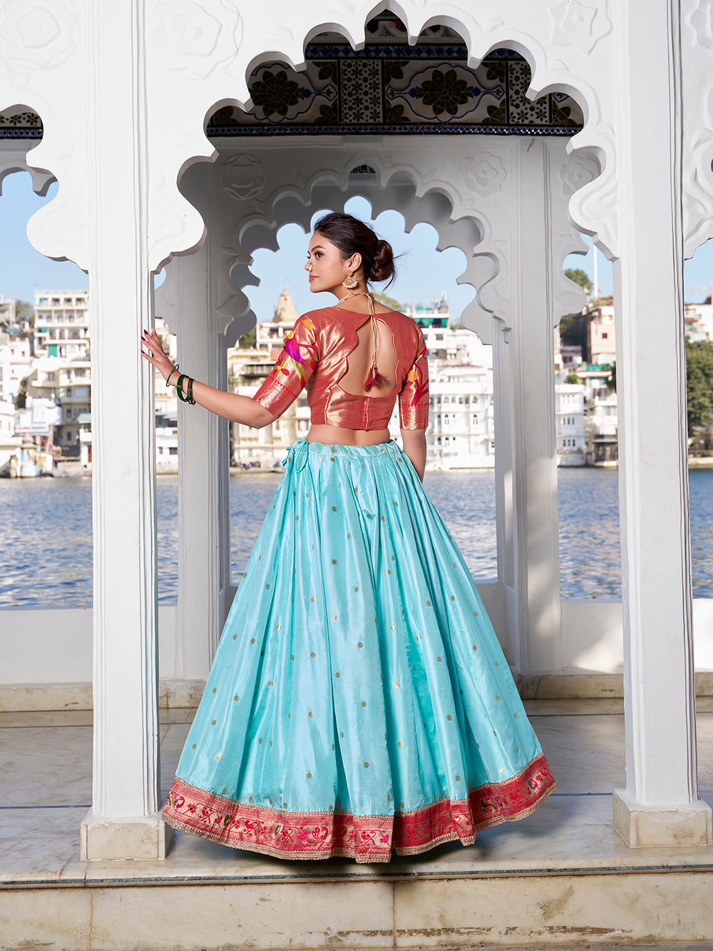 Sky blue jacquard silk lehenga choli with zari weaving matching potli purse