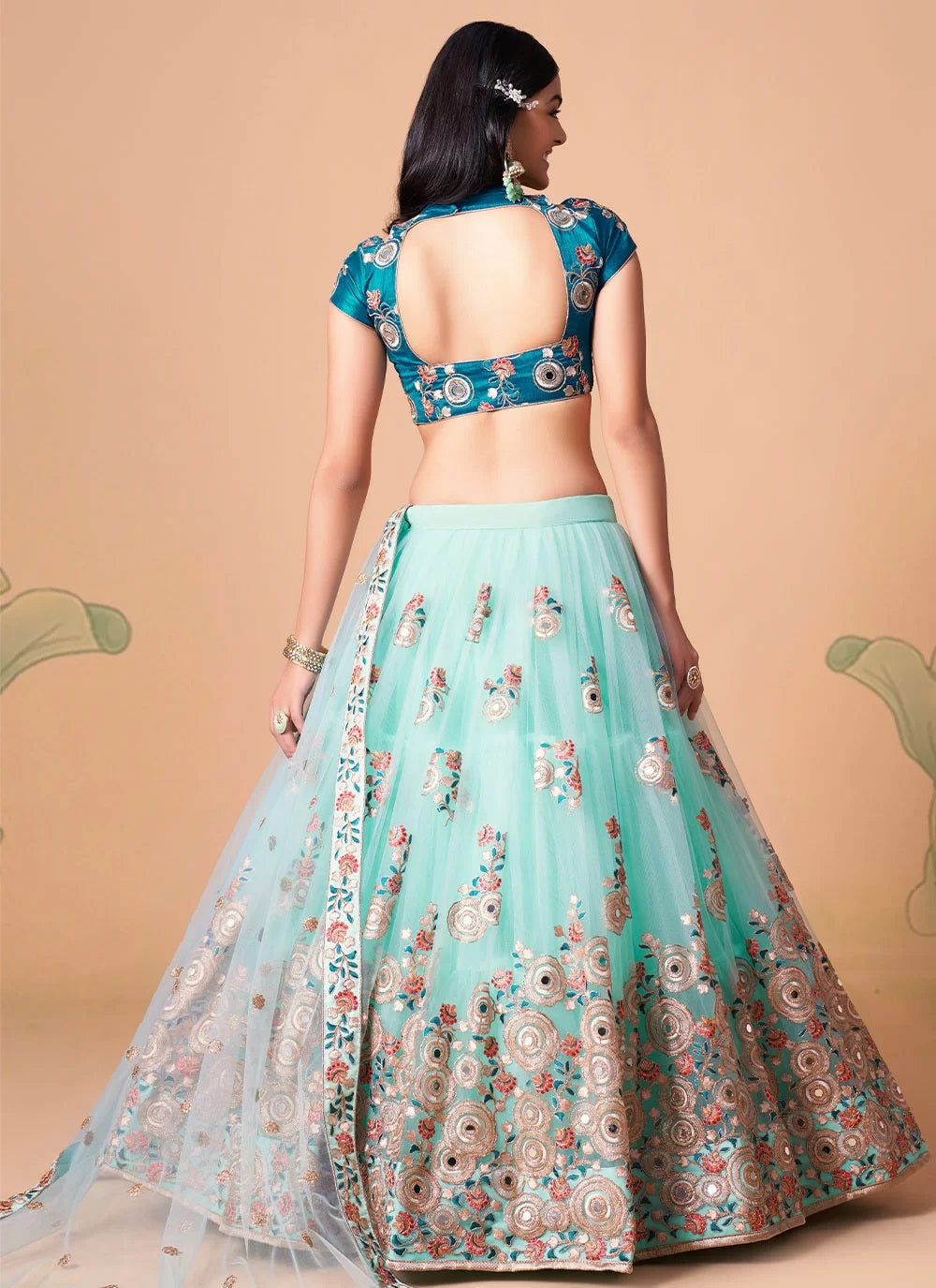 Sky blue gorgeous net lehenga with gold zari and dori embroidery