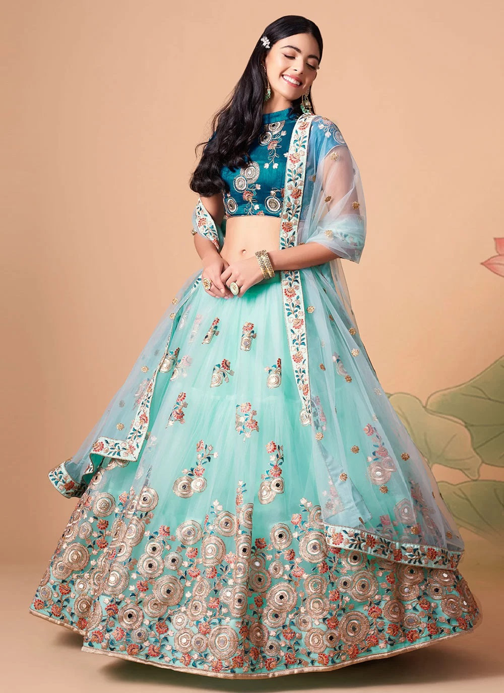 Sky blue gorgeous net lehenga with gold zari and dori embroidery