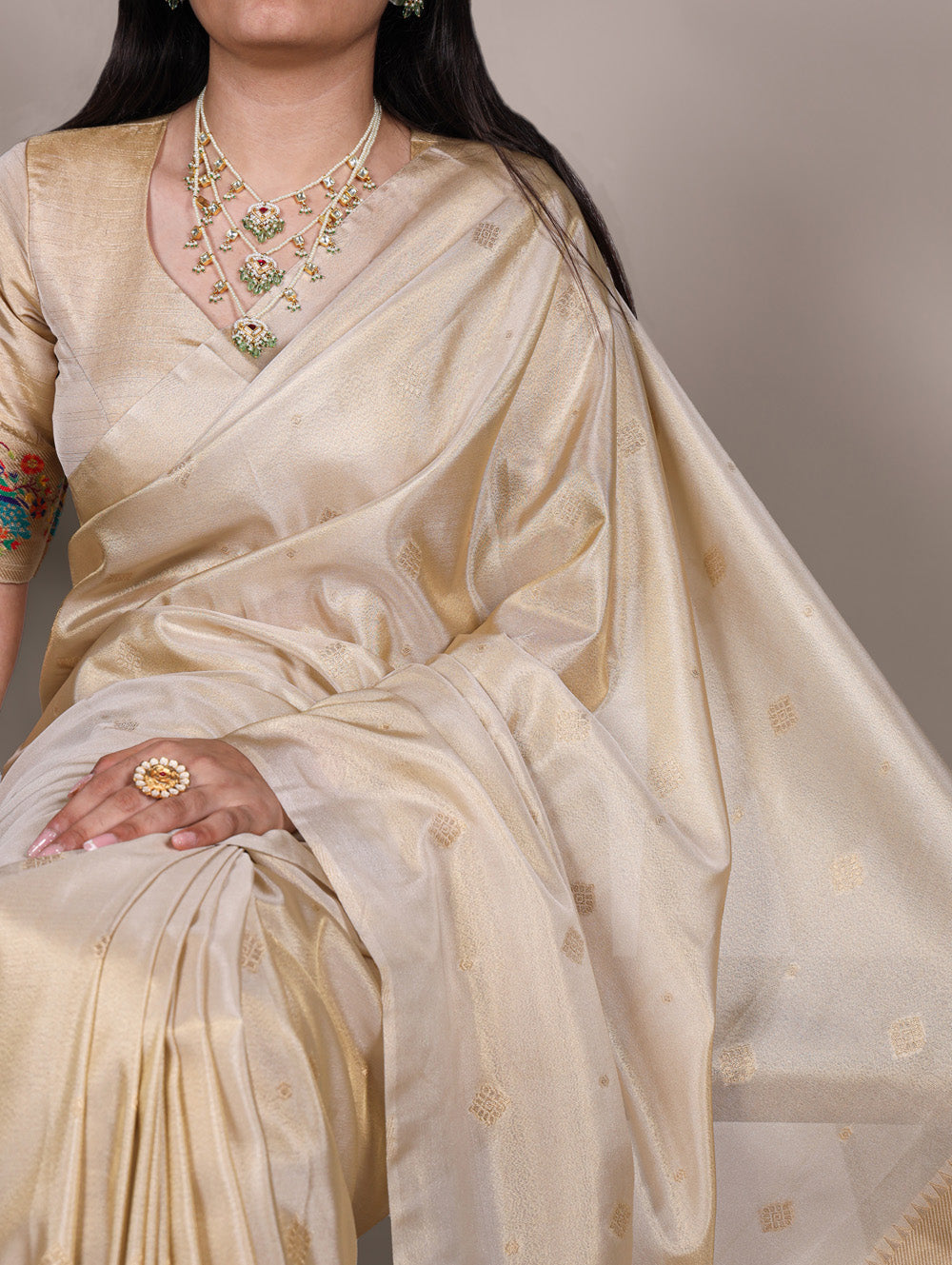 Cream tissue paithani saree with intricate zari weaving unstitched blouse