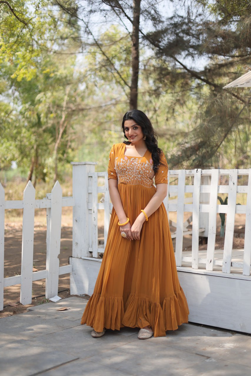 Sparkling Multithreaded Embroidered Faux Georgette Mustard Yellow Gown with Puff Sleeves