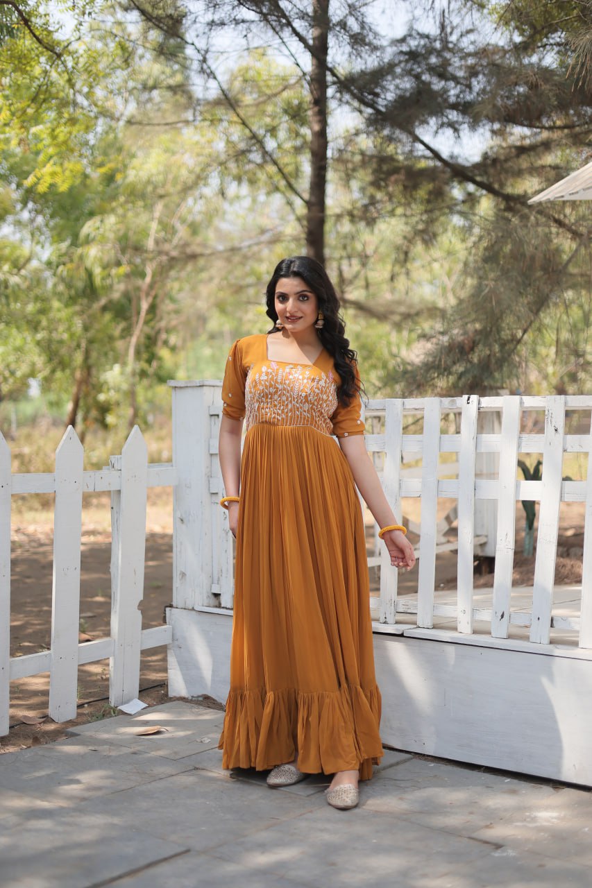 Sparkling Multithreaded Embroidered Faux Georgette Mustard Yellow Gown with Puff Sleeves
