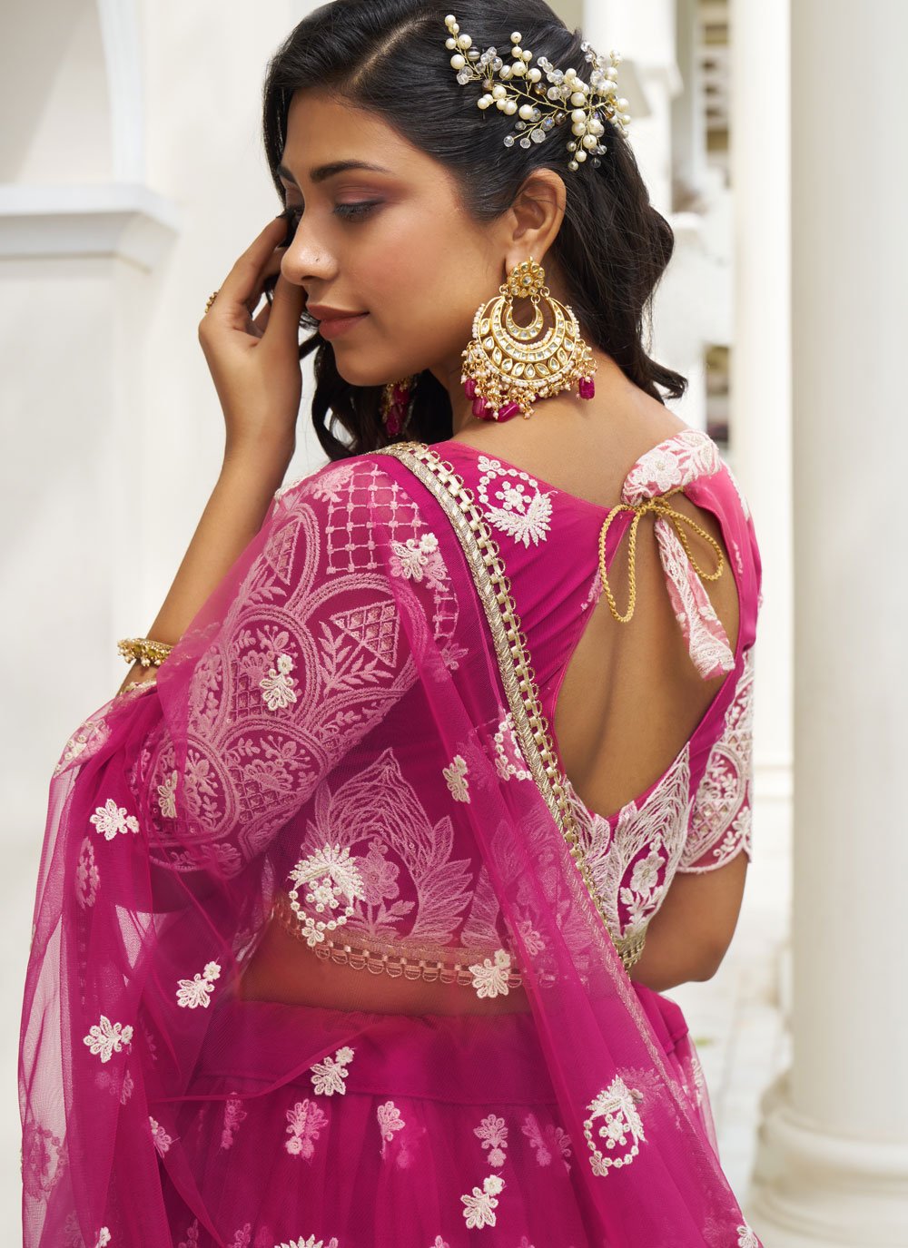 Stunning dark pink butterfly net embroidered party wear lehenga set