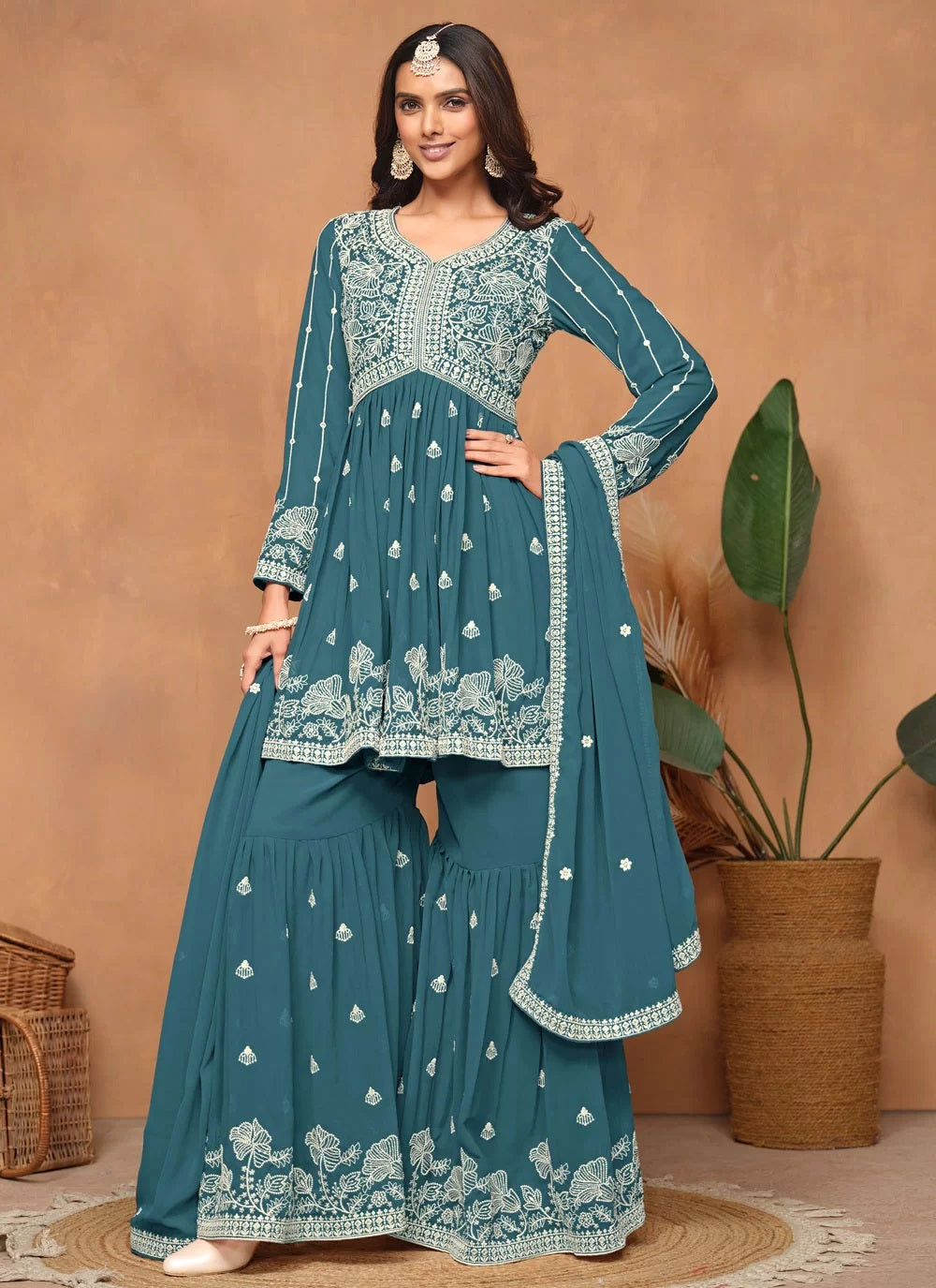Stunning teal faux georgette embroidered sharara style suit