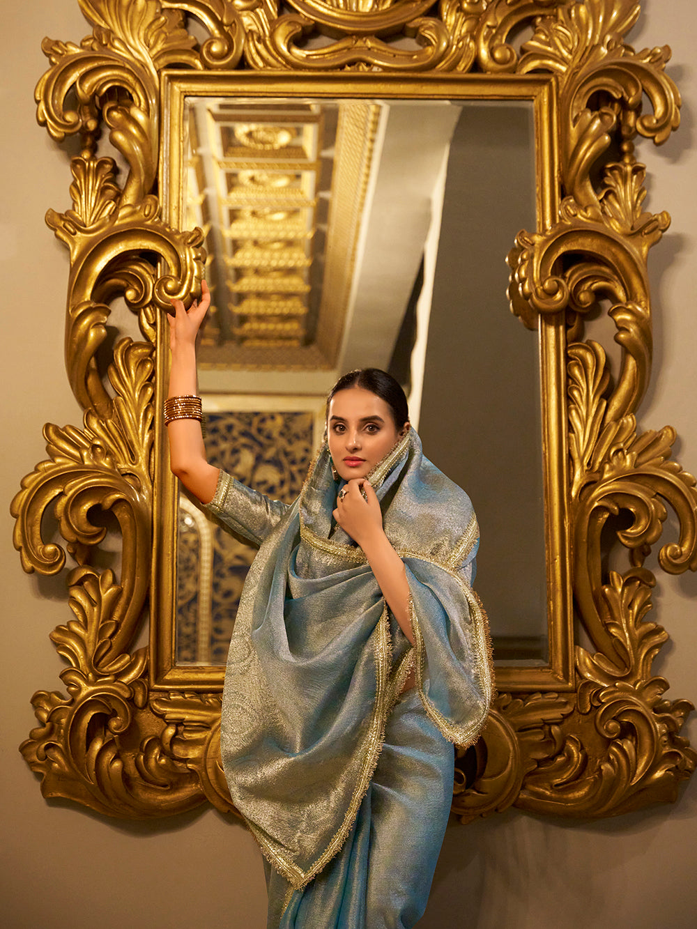 Sky blue zari weaving tissue shimmer saree with sequins lace border and matching blouse