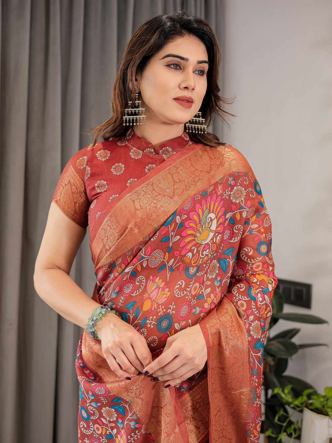 Graceful rust orange floral cotton linen saree with zari border tassels