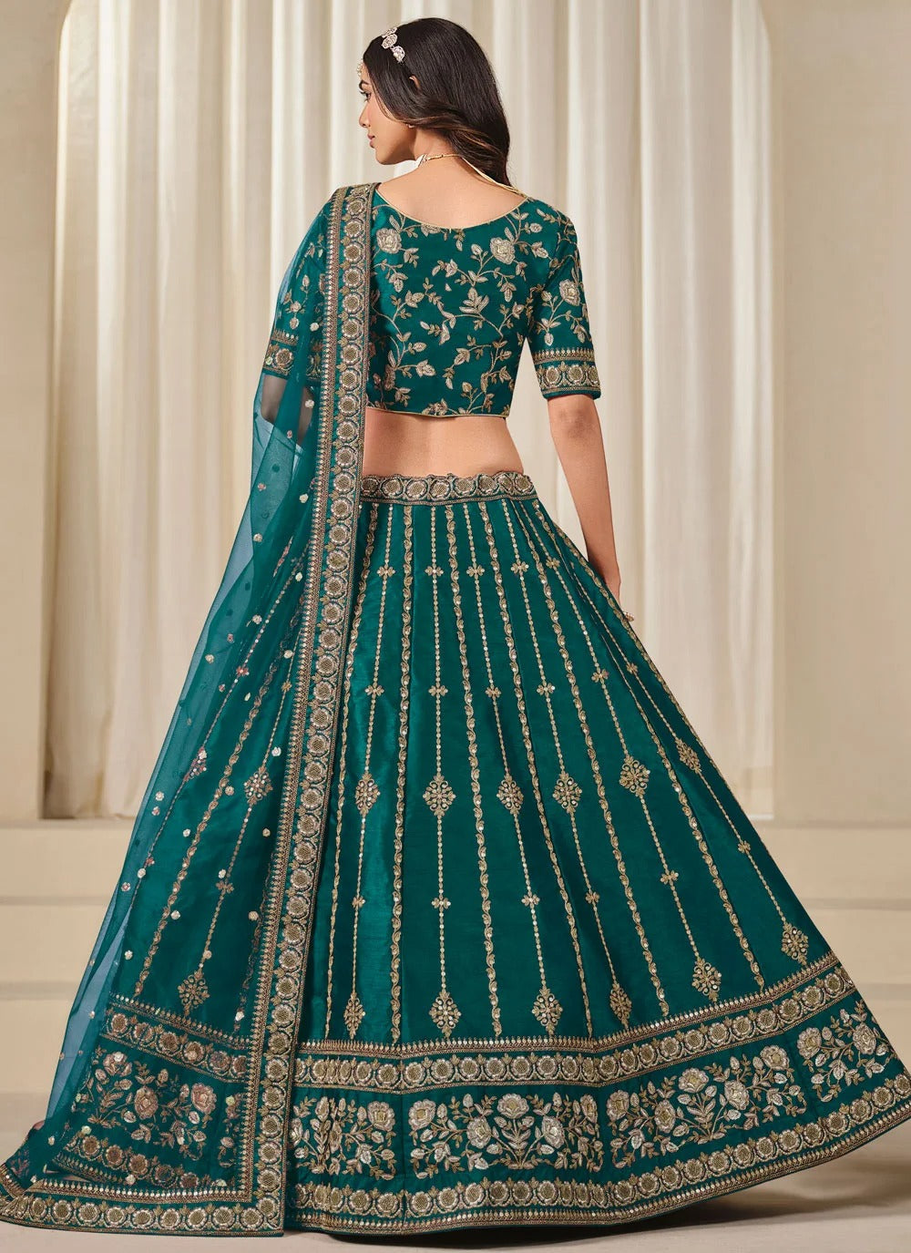 Elegant teal bridesmaid lehenga in art silk with embroidered net dupatta