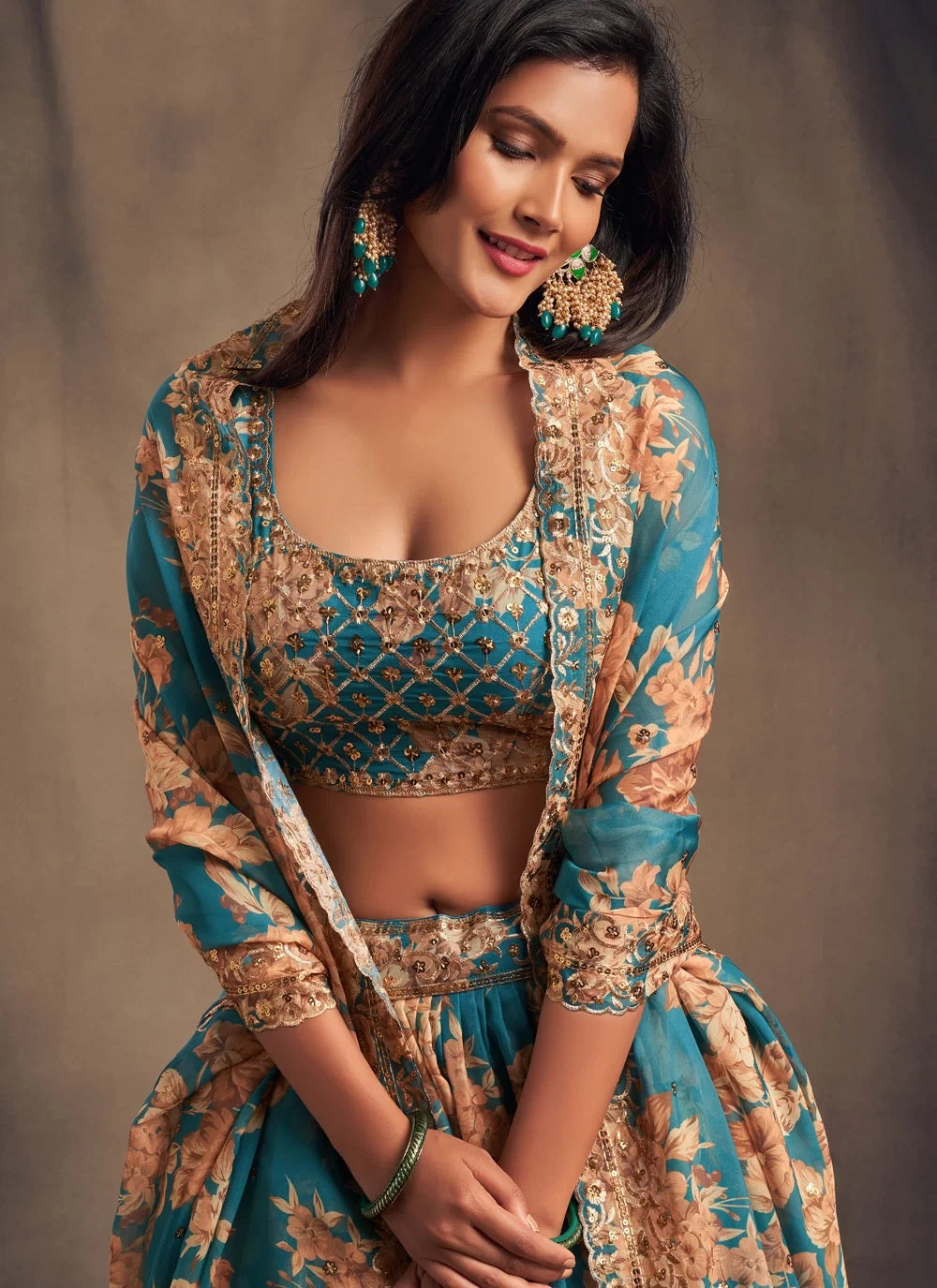 Teal blue zari embroidered organza based lehenga